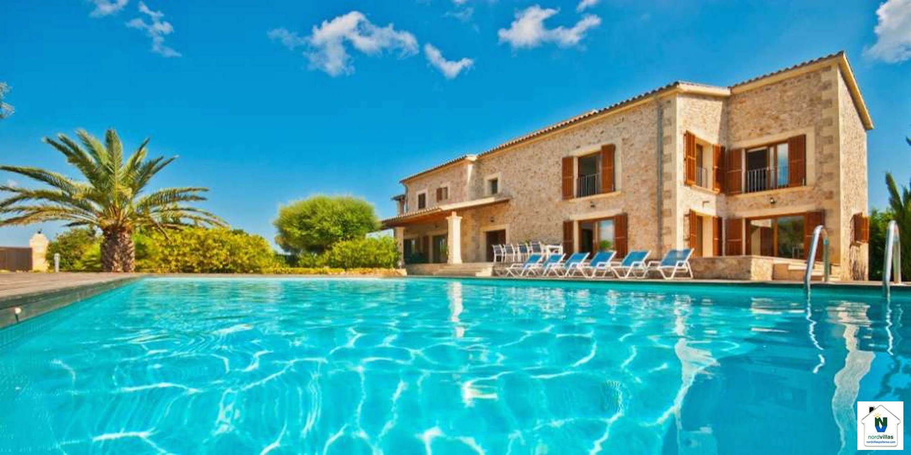 Swimming pool and sun loungers