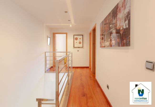 Hallway on the first floor with access to the rooms Corridor with access to the rooms on the top floor