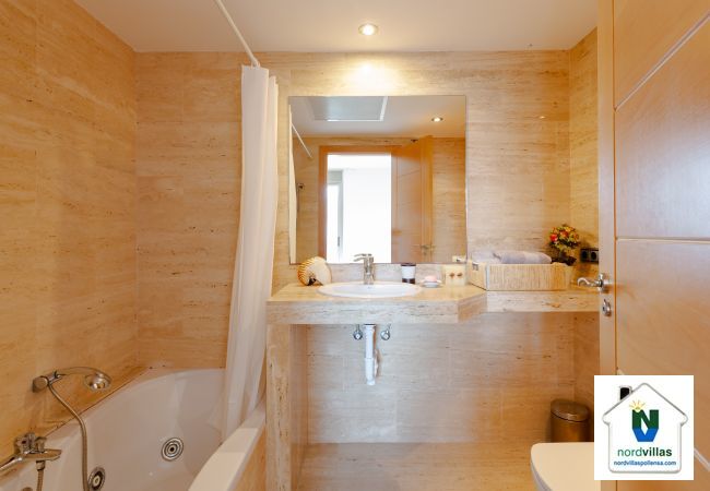 En suite bathroom with bath in the main double room Full bathroom with ensuite bath in the master bedroom