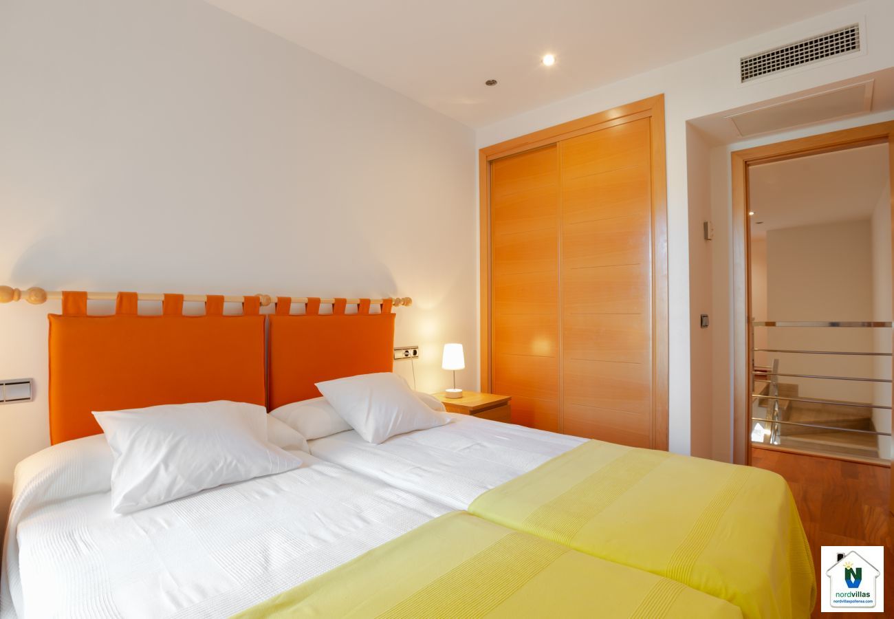 Room with built-in wardrobe and two single beds together Double bedroom on upper floor